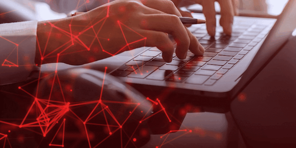 Hands typing on a laptop keyboard, overlaid with a red digital network pattern, suggesting connectivity and technology. Mood is focused and innovative.